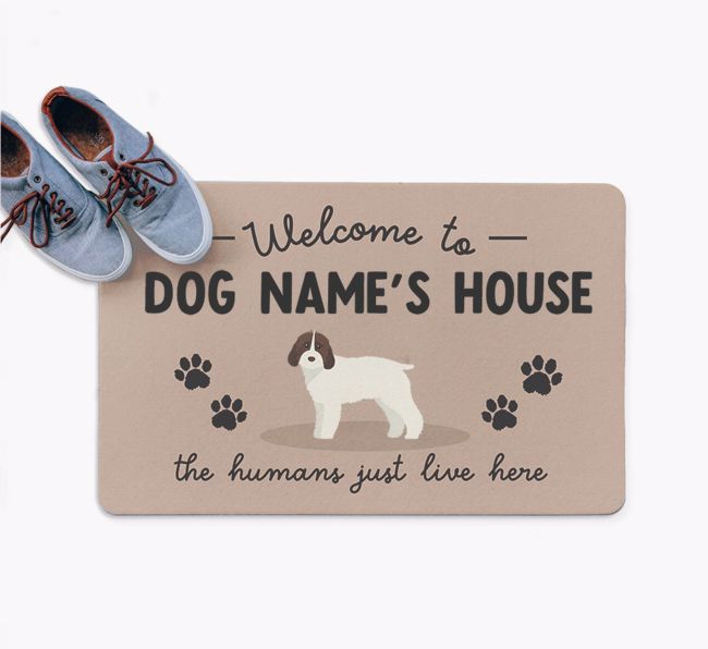 The Humans Just Live Here: Personalized {breedFullName} Doormat